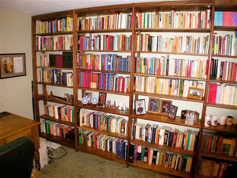 full wall book case unit in walnut w- bloodwood inlay.jpg