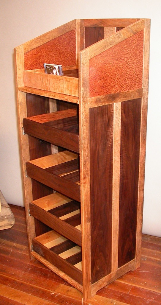 library media case awaiting delivery to a public library in maple walnut and redwood burl.jpg